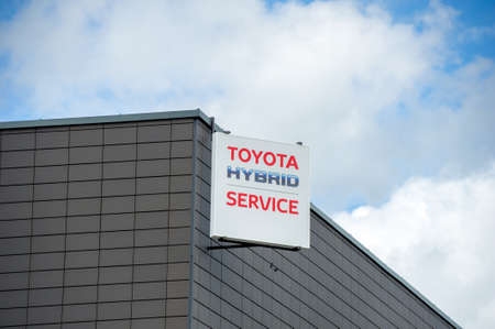 VILNIUS, LITHUANIA - AUGUST 7, 2016: Toyota Hybrid Service logo. Toyota Motor Corporation is a Japanese automotive manufacturer. Hybrid Synergy Drive (HSD) is the brand name of Toyota.のeditorial素材