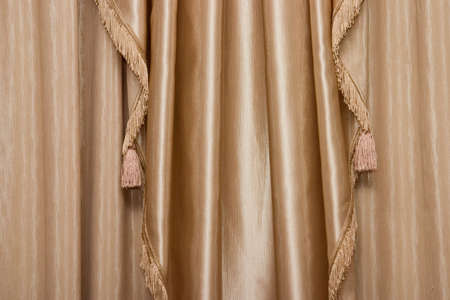 Hanging beige curtainの写真素材
