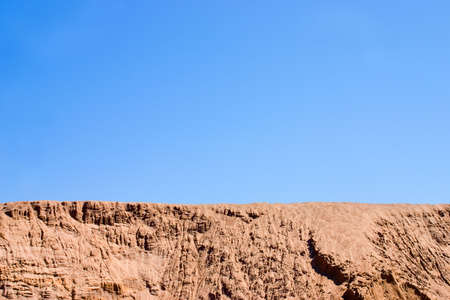 Desert landscape. A heap of sand on a building siteの写真素材