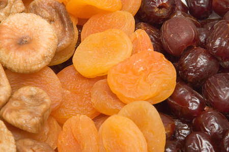 Assortment of dried fruits: figs, apricots and datesの写真素材