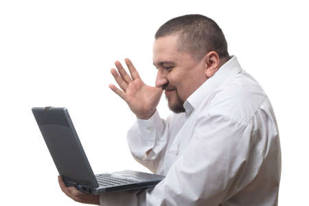 Businessman looking with joy at the screen of his notebookの写真素材