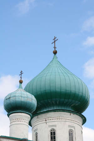 Russia, Staraya Ladoga. Cupolas of Orthodox church against blue skyの写真素材