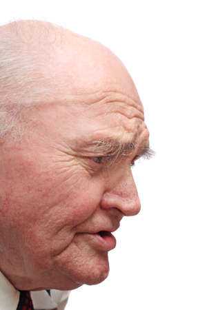 Side-view of bald senior man, isolated on white backgroundの写真素材