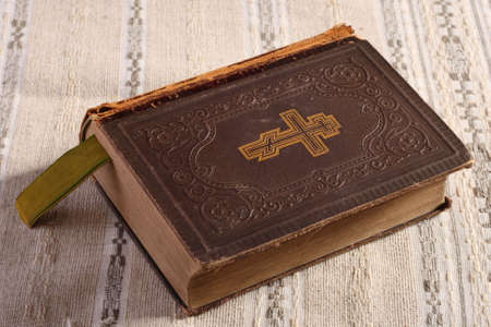 Old Orthodox bible on linen napkinの写真素材
