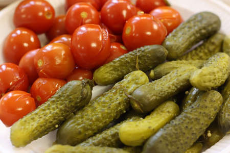 Pickled cucumbers and tomatoes, close-upの写真素材