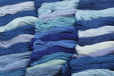 Background of blue hanks of embroidery yarn