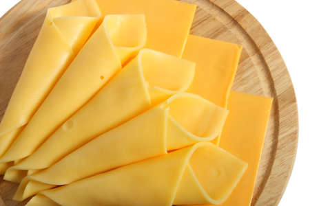 Cheese slices on wooden platter, isolated on white background