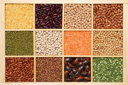 Set of various pulses in wooden compartment boxの写真素材