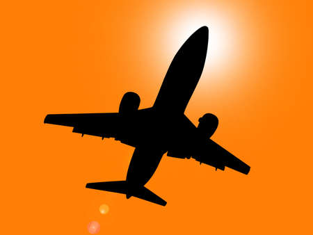 Silhouette of jet aircraft flying overhead at sunset with sun directly behind cabin.
