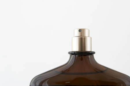 fragment of spray-bottle with perfumes on a white backgroundの写真素材