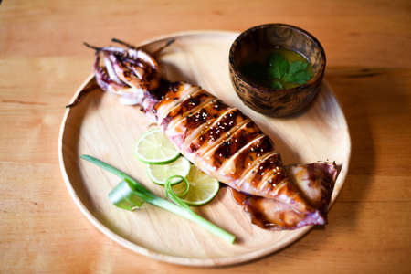 Grilled Squid with Spicy Seafood Sauce in Thai styleの写真素材
