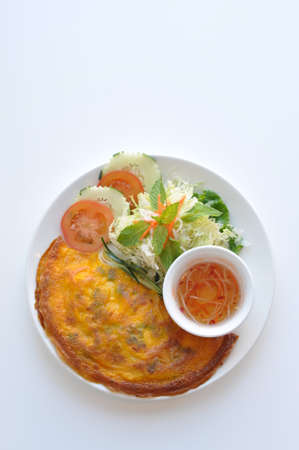 Vietnamese Crepe. A thin crape filled with shrimp, pork, scallion and bean sprout. Served with homemade sauce.の写真素材