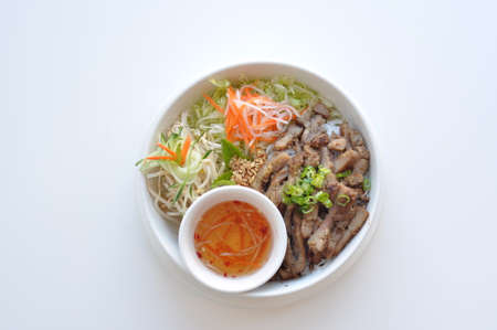 Grilled Pork Bun. Traditional Vietnamese rice vermicelli dish with shredded lettuce, bean sprout,...
