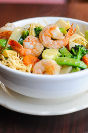 Goey See Me, Crispy egg noodle topped with broccoli, mushroom, bamboo shoot, peapod, carrot, baby...