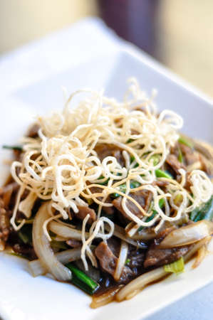 Stir-Fried Mongolian Beef, Stir-fried beef with green and white onion in a special sauce and topped...