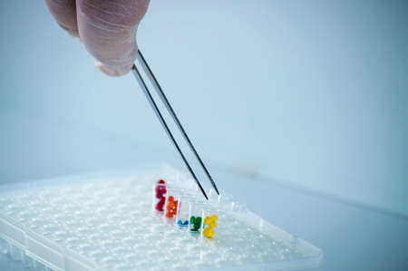 Laboratory pipette with multi-colored test tubesの写真素材