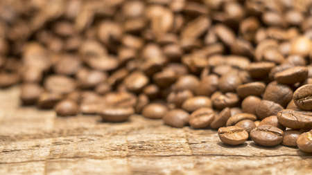 coffee beans on a wooden backgroundの写真素材