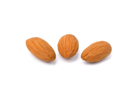 Pile of fresh almonds isolated on white backgroundの写真素材