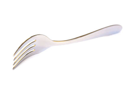 Shiny metal fork on a white backgroundの写真素材