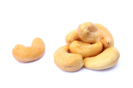 Peeled salted cashews isolated on a white backgroundの写真素材