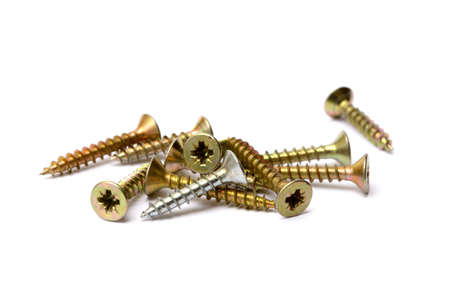Pile of wood screws isolated on white backgroundの写真素材