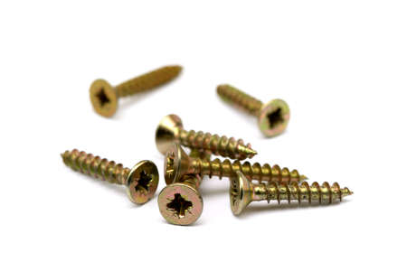 Scattered wood screws isolated on white backgroundの写真素材