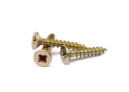 Scattered wood screws isolated on white backgroundの写真素材