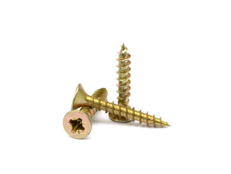 Scattered wood screws isolated on white backgroundの写真素材