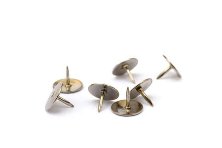 Ordered pile pushpins isolated on white background