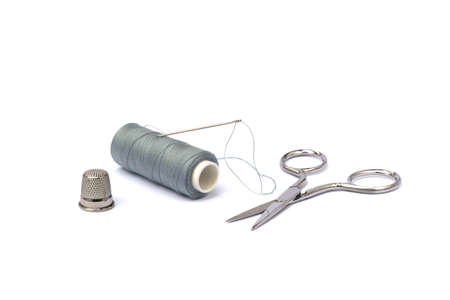 Needle, thimble, scissors, thread isolated on white backgroundの写真素材