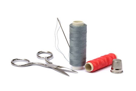 Needle, thimble, scissors, thread isolated on white backgroundの写真素材