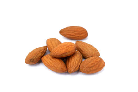 Group of fresh almonds isolated on white backgroundの写真素材