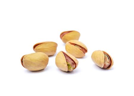 Pile of fruit Pistachios isolated on white backgroundの写真素材