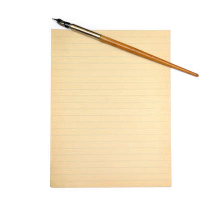 Old pen and lined paper isolated on white backgroundの写真素材
