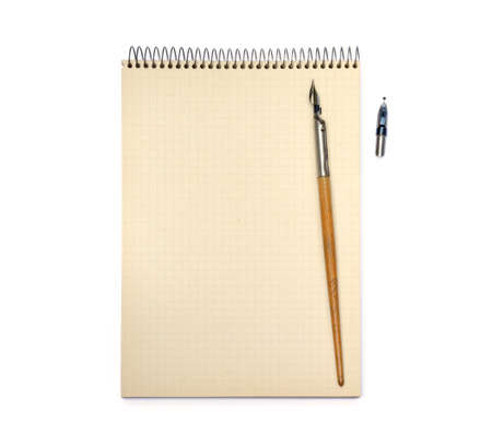 Old ink pen and lined paper isolated on white backgroundの写真素材