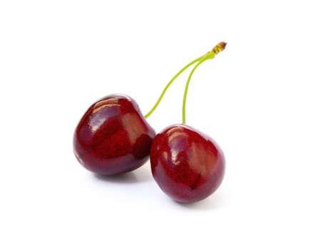 Tasty ripe cherries isolated with white backgroundの写真素材