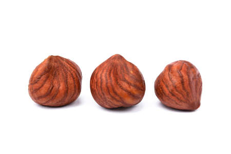 Group healty hazelnuts isolated on white backgroundの写真素材