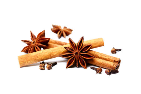 Aromatic star anise, cloves and cinnamon isolated on white backgroundの写真素材