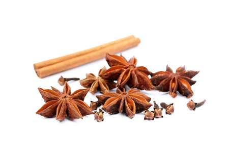 Aromatic star anise, cloves and cinnamon isolated on white backgroundの写真素材