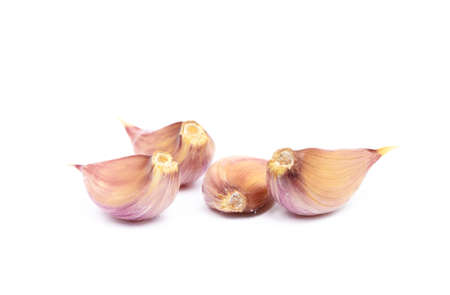 Fresh garlic cloves isolated on white backgroundの写真素材