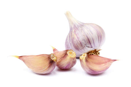 Fresh garlic cloves isolated on white backgroundの写真素材