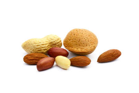 Almonds and peanuts isolated on white background.の写真素材