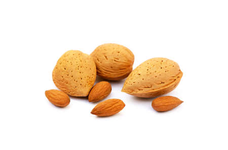 Heap of fresh almonds in shells isolated on white backgroundの写真素材