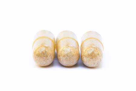 Natural medicine capsules isolated on a white backgroundの写真素材