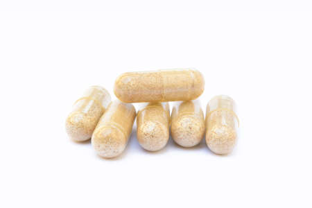 Natural medicine capsules isolated on a white backgroundの写真素材