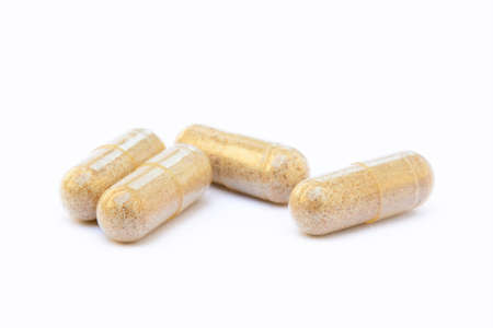 Natural medicine capsules isolated on a white backgroundの写真素材