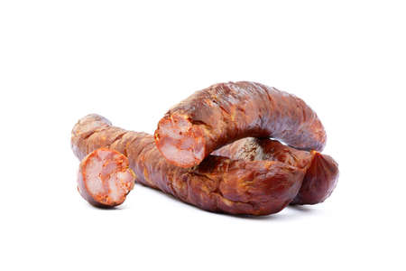 Tasty high quality smoked sausage isolated on white backgroundの写真素材