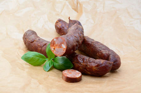 Tasty high quality smoked sausage isolated on white backgroundの写真素材