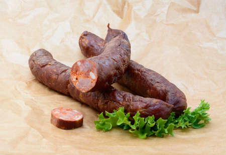 Tasty high quality smoked sausage isolated on white backgroundの写真素材