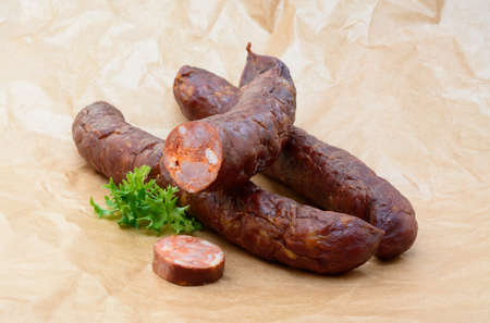 Tasty high quality smoked sausage isolated on white backgroundの写真素材
